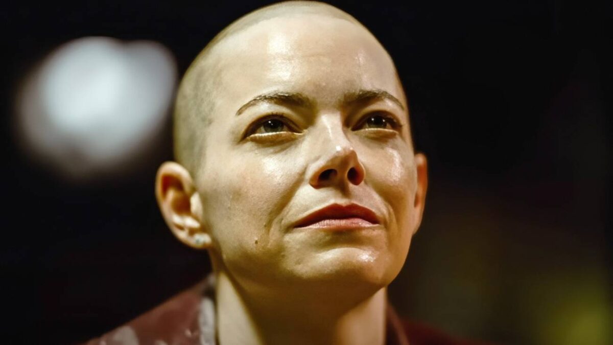 A close-up on Emma Stone looking superior and satisfied in Bugonia