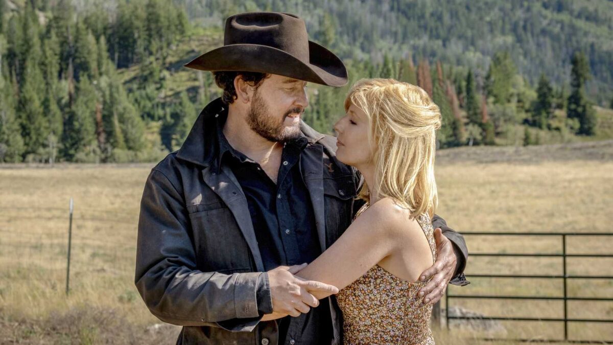 Beth and Rip caught in a loving embrace in a still from Yellowstone