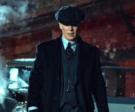 Cillian Murphy as Tommy Shelby walking through Birmingham in Peaky Blinders The Immortal Man