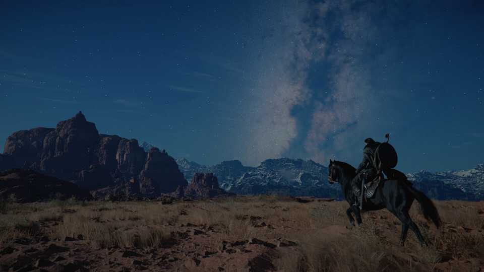 Rider on horseback under starry night sky.