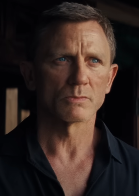 Daniel Craig as James Bond in the No Time To Die (2021) trailer, wearing a black shirt