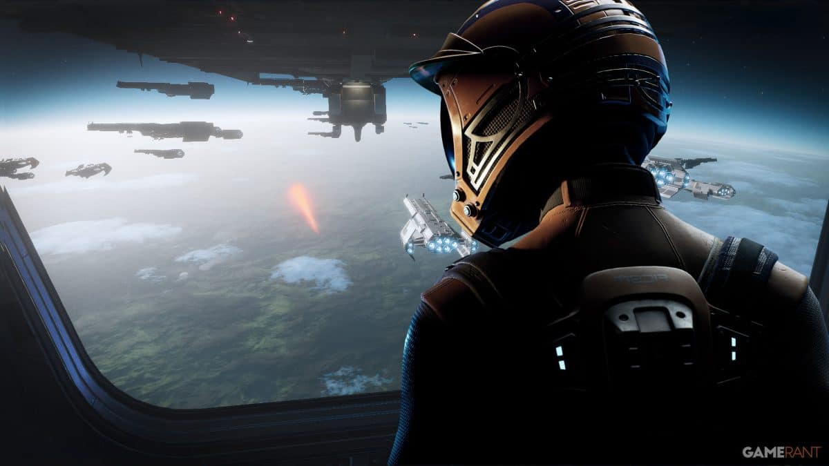 Astronaut views spaceships from spacecraft window.