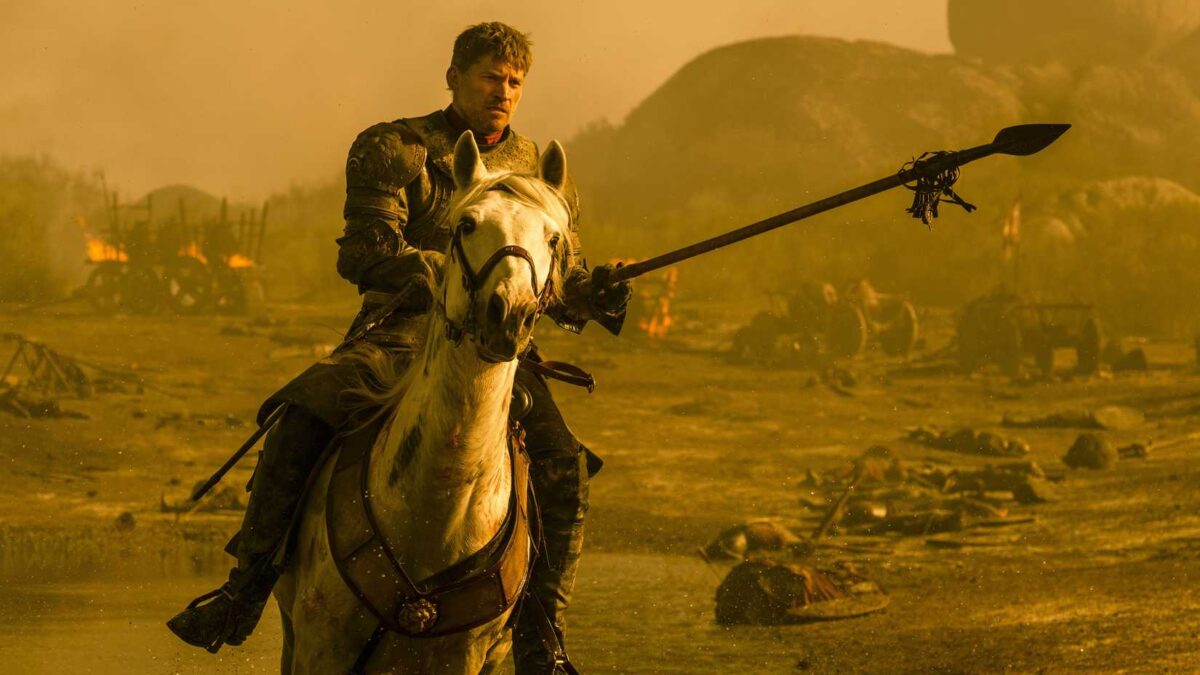 Nikolaj Coster-Waldau as Jaime Lannister charging on a horse in Game of Thrones.